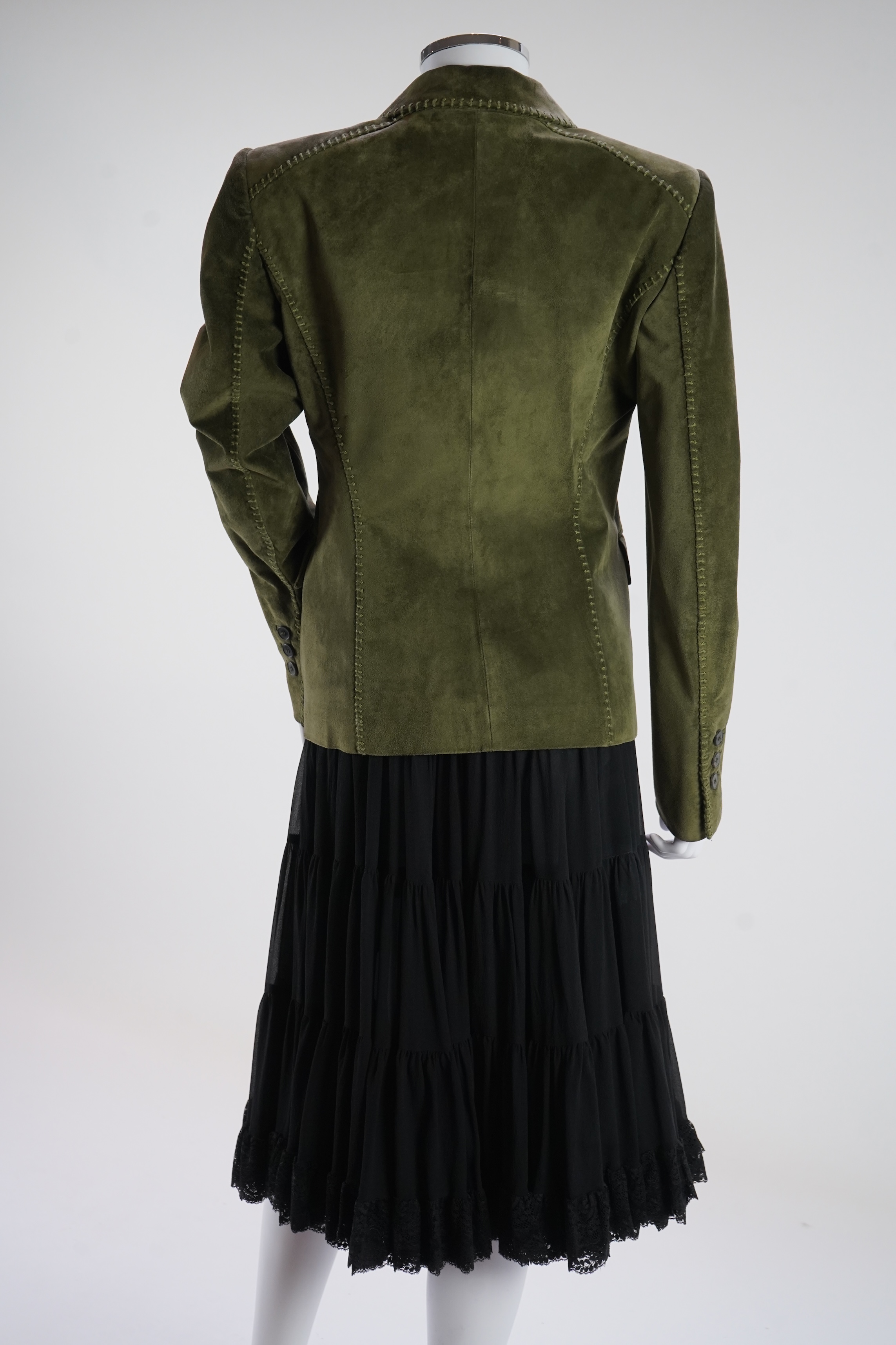 A lady's Yves Saint Laurent olive green suede jacket with stitching details and a black YSL (label missing) gypsy skirt with underskirt. IT 38 (UK size 10)